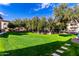 Landscaped lawn with a walkway and trees at 3330 S Gilbert Rd # 2001, Chandler, AZ 85286