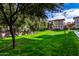 Landscaped lawn area with mature trees at 3330 S Gilbert Rd # 2001, Chandler, AZ 85286