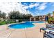 Community pool with lounge chairs and a spa at 3330 S Gilbert Rd # 2001, Chandler, AZ 85286