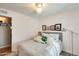 Bedroom with gray bedding, ceiling fan, and access to hallway at 3343 E Anderson Dr, Phoenix, AZ 85032