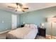 Spacious bedroom with a queen-size bed and a ceiling fan at 3343 E Anderson Dr, Phoenix, AZ 85032