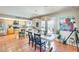 Dining area with a farmhouse table and chairs, adjacent to kitchen and patio at 3343 E Anderson Dr, Phoenix, AZ 85032