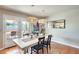 Bright dining room with patio access and modern light fixtures at 3343 E Anderson Dr, Phoenix, AZ 85032