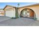 Inviting front entry with brick pavers and wooden door at 3343 E Anderson Dr, Phoenix, AZ 85032