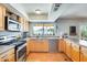 View of kitchen with stainless steel appliances and a view to the backyard at 3343 E Anderson Dr, Phoenix, AZ 85032