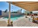 Inviting pool area with patio furniture under a covered patio at 3343 E Anderson Dr, Phoenix, AZ 85032