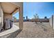 Landscaped backyard with gravel and a covered patio at 36085 W Prado St, Maricopa, AZ 85138