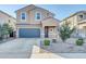 Two-story house with gray garage door and landscaping at 36085 W Prado St, Maricopa, AZ 85138