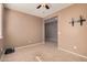 Bright bedroom featuring tile floors and ceiling fan at 3667 S 185Th Dr, Goodyear, AZ 85338