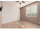 Simple bedroom with tile floors and ceiling fan at 3667 S 185Th Dr, Goodyear, AZ 85338