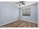 Light and airy bedroom with wood-look floors and ceiling fan at 3667 S 185Th Dr, Goodyear, AZ 85338