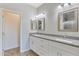 Modern bathroom with double vanity, granite countertop, and white cabinets at 3730 N Maya Rd, Eloy, AZ 85131