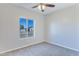 Well-lit bedroom featuring grey carpet and a window at 3730 N Maya Rd, Eloy, AZ 85131