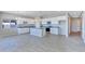 Open kitchen with white cabinets, granite countertops, and kitchen island at 3730 N Maya Rd, Eloy, AZ 85131