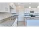 Modern kitchen with white cabinets, granite countertops and stainless steel sink at 3730 N Maya Rd, Eloy, AZ 85131