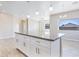 Modern kitchen island with granite countertop and white cabinets at 3730 N Maya Rd, Eloy, AZ 85131