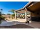 Landscaped backyard with desert plants and covered patio at 3832 N 162Nd Ln, Goodyear, AZ 85395