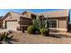 Tan house with cacti and gravel landscaping at 3832 N 162Nd Ln, Goodyear, AZ 85395