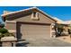 Tan house with a two-car garage at 3832 N 162Nd Ln, Goodyear, AZ 85395