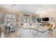 Spacious kitchen island with granite countertops and white cabinets at 3832 N 162Nd Ln, Goodyear, AZ 85395