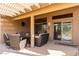 Relaxing patio with covered pergola and comfortable seating at 3832 N 162Nd Ln, Goodyear, AZ 85395