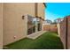 Private backyard with sliding glass doors and grassy area at 4124 E Toledo St, Gilbert, AZ 85295