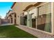 Backyard with sliding glass doors and grassy area at 4124 E Toledo St, Gilbert, AZ 85295