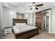 Main bedroom with barn door entry to en-suite bathroom and walk-in closet at 4124 E Toledo St, Gilbert, AZ 85295