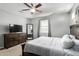 Comfortable bedroom with a dresser, mirror, and ceiling fan at 4124 E Toledo St, Gilbert, AZ 85295