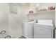 Convenient laundry room includes washer, dryer, and shelving at 4124 E Toledo St, Gilbert, AZ 85295