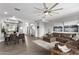 Open living space with dining area and brown sectional sofa at 4124 E Toledo St, Gilbert, AZ 85295