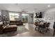 Open living area with a brown sectional sofa and a dining table at 4124 E Toledo St, Gilbert, AZ 85295