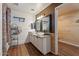 Bathroom with double vanity, large mirrors, and walk-in closet at 4360 E Sierrita Rd, San Tan Valley, AZ 85143