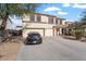 Two-story house with a three-car garage and landscaped front yard at 4360 E Sierrita Rd, San Tan Valley, AZ 85143