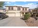 Two-story house with a three-car garage and landscaped front yard at 4360 E Sierrita Rd, San Tan Valley, AZ 85143