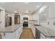 Spacious kitchen featuring granite countertops and white cabinetry at 4360 E Sierrita Rd, San Tan Valley, AZ 85143