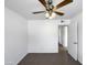 Bedroom with ceiling fan, door to hallway and tile floor at 4511 W Cavalier Dr, Glendale, AZ 85301