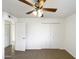 Bright bedroom with ceiling fan, double door closet and tile flooring at 4511 W Cavalier Dr, Glendale, AZ 85301