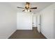 Well-lit bedroom with ceiling fan and access to bathroom at 4511 W Cavalier Dr, Glendale, AZ 85301