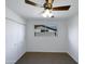 Bedroom with large window, ceiling fan and double door closet at 4511 W Cavalier Dr, Glendale, AZ 85301