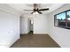 Bedroom with private bathroom access, ceiling fan and double door closet at 4511 W Cavalier Dr, Glendale, AZ 85301