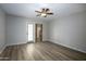 Spacious bedroom with wood flooring and ceiling fan at 4605 E Valley View Dr, Phoenix, AZ 85044