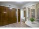 Bright entryway with tile flooring, wood closet doors, and a small table at 4605 E Valley View Dr, Phoenix, AZ 85044