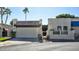 Front view of a charming home with a Spanish-style facade and attached garage at 4605 E Valley View Dr, Phoenix, AZ 85044