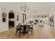 Stunning dining room with a dark wood table and chairs, and a built in bar at 5101 N Casa Blanca Dr # 301, Paradise Valley, AZ 85253