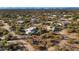 Aerial view of a property with two homes and desert landscaping at 5743 E Windstone Trl, Cave Creek, AZ 85331