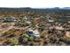 Aerial view of a desert property with a large home and pool at 5743 E Windstone Trl, Cave Creek, AZ 85331