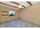 Bright bedroom with tiled floors and wood beams at 5743 E Windstone Trl, Cave Creek, AZ 85331