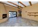 Living room with tile floors, fireplace, and view of pool at 5743 E Windstone Trl, Cave Creek, AZ 85331