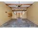 Living room with tile floors, exposed wood beams, and a fireplace at 5743 E Windstone Trl, Cave Creek, AZ 85331